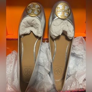 Brand New Tory Burch silver ballot flats with gold emblem